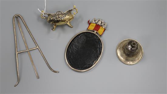 A Victorian silver table bell (lacking handle), an oval white metal photograph frame with silver easel and oval silver gilt salt.